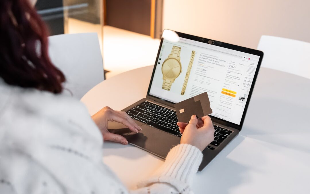 Merchant reviewing a payment dashboard on a laptop while setting up USDC payments in a modern workspace