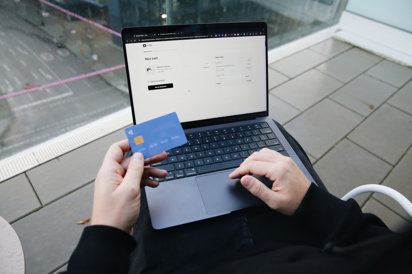 Finance professional using a laptop at a clean desk while reviewing stablecoin payment options