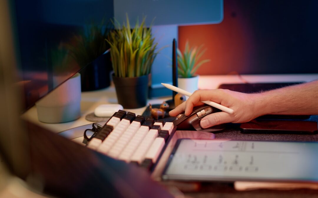 A merchant reviewing a stablecoin payments dashboard on a laptop in a modern workspace