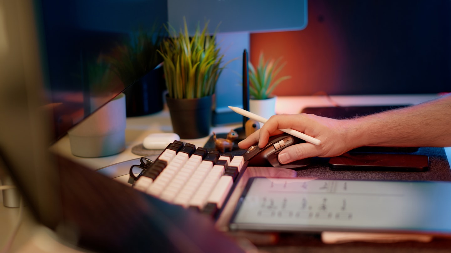 A merchant reviewing a stablecoin payments dashboard on a laptop in a modern workspace